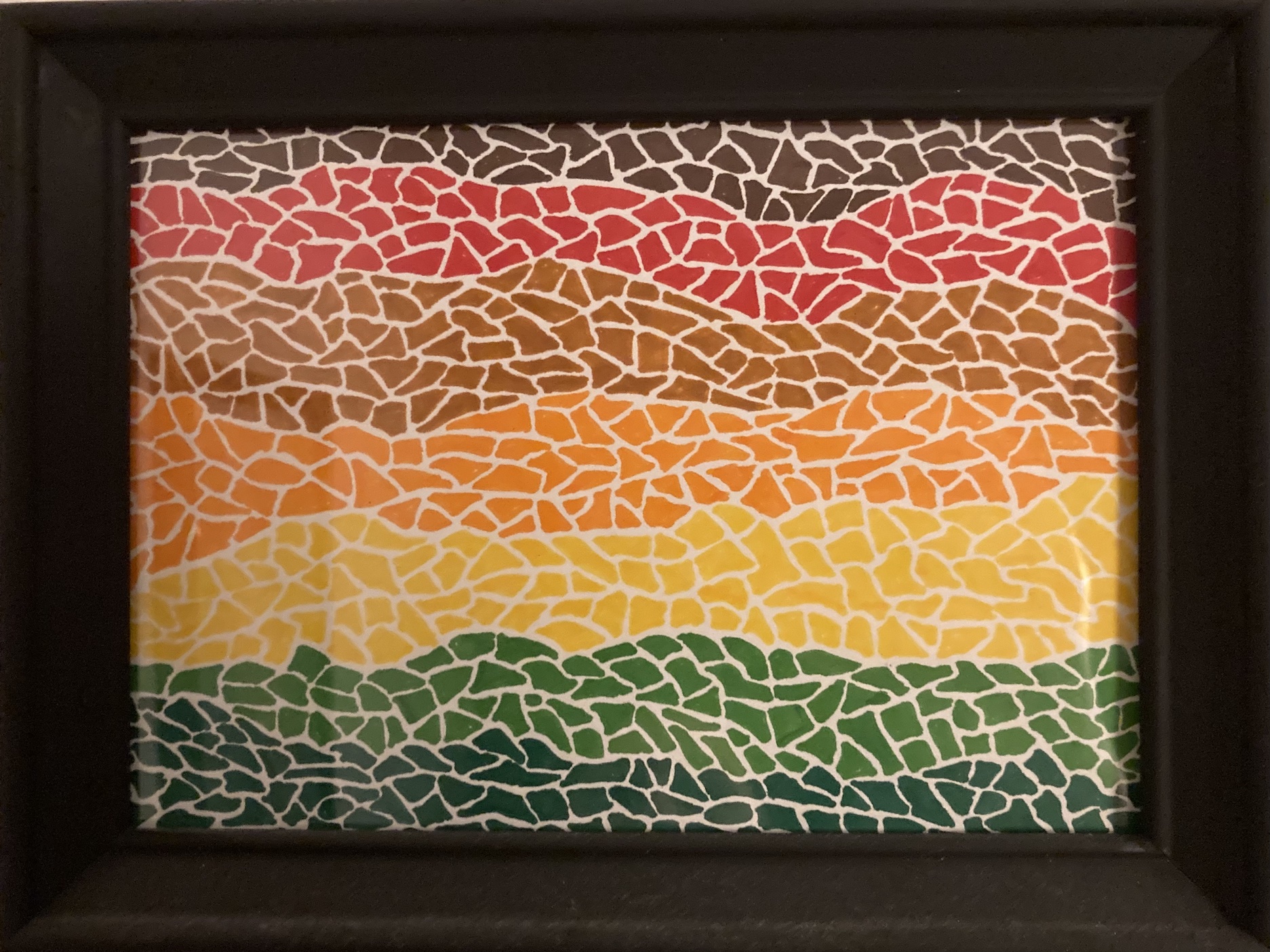 a picture of a framed marker on paper drawing consisting of small abstract shapes in bands of seven colors evocative of a moasaic